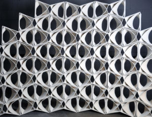 wall of 3D printed tiles that make an ornate pattern